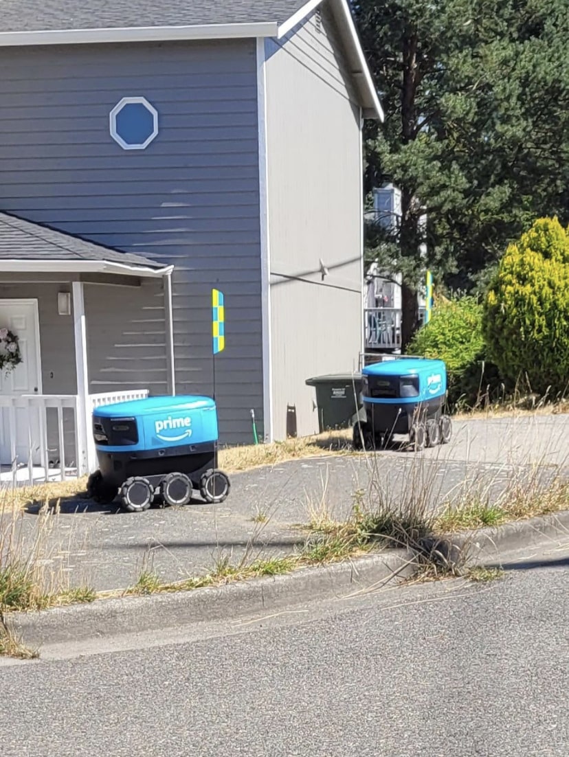 Amazon Prime delivery drones in a street.